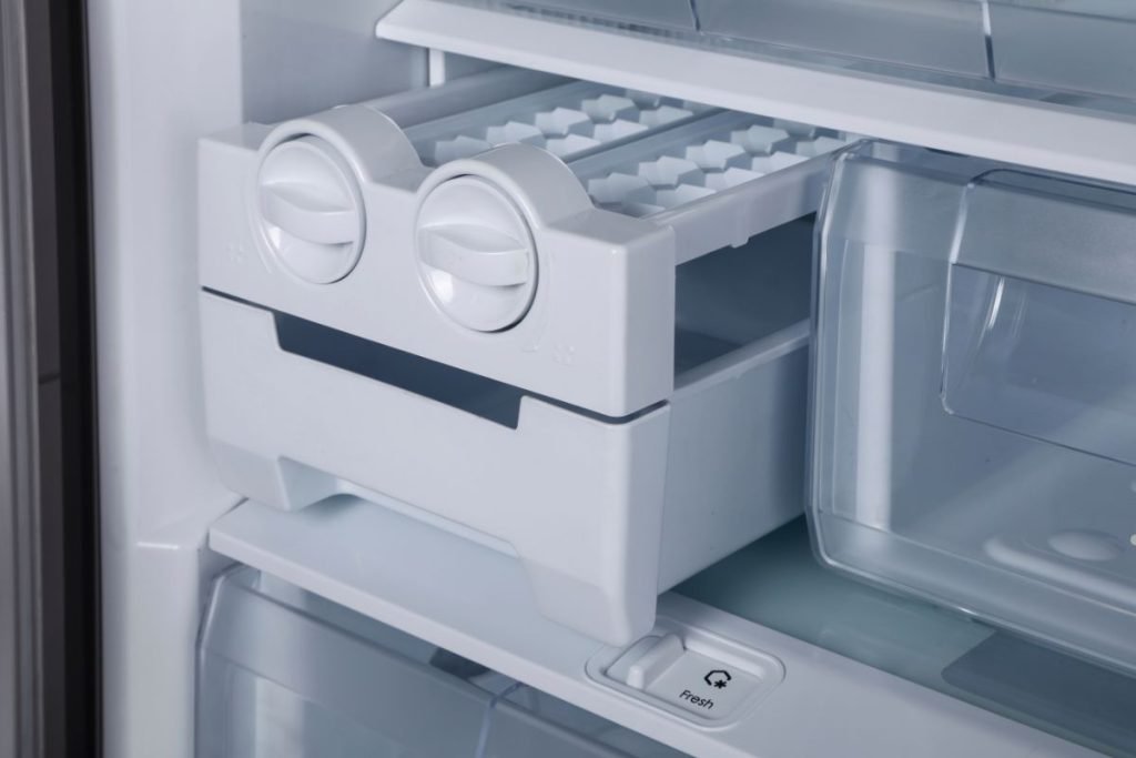 A modern refrigerator featuring dual ice makers and a spacious freezer compartment for optimal food storage.